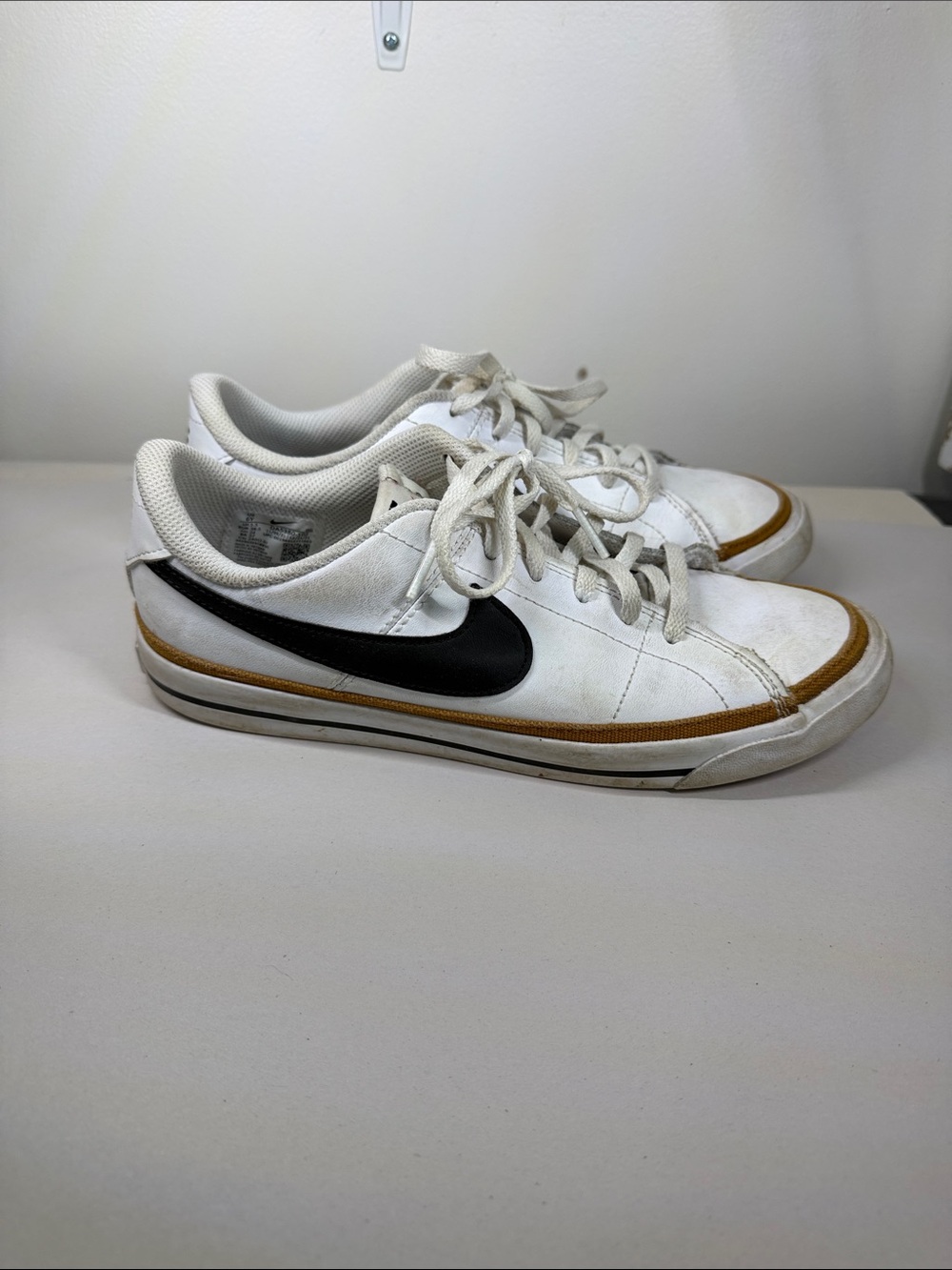 Nike White Low-Top‎ Sneakers with Black Swoosh and Brown Trim
